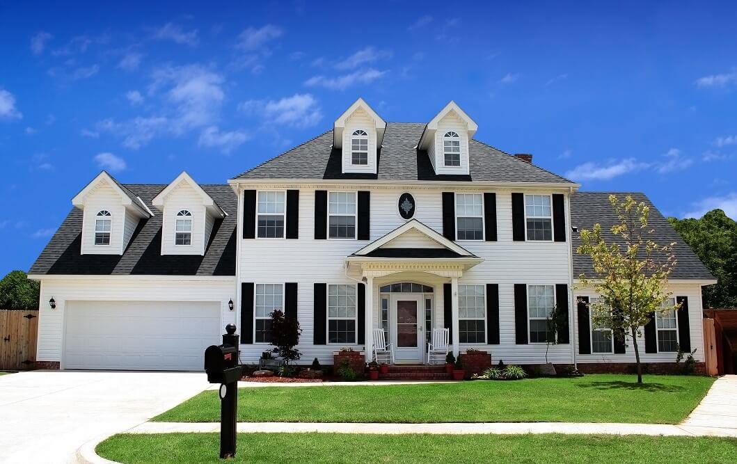 Front view of a large white house.