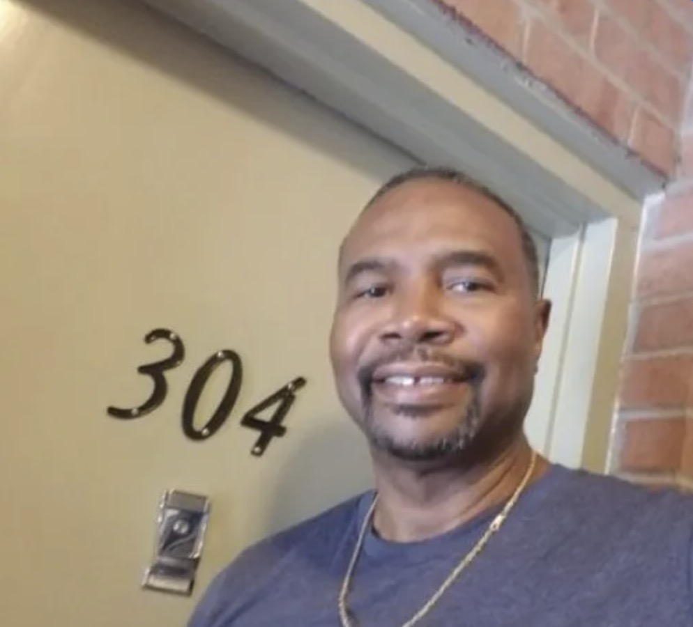 picture of Vernon D. in front of a house